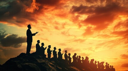 Fototapeta premium People silhouetted at sunset