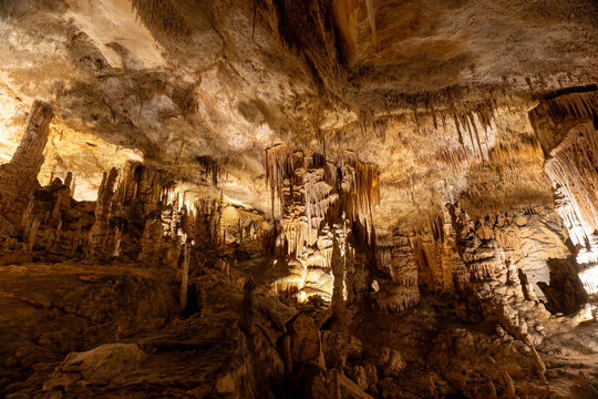 Cave texture background with stalactites and stalagmites natural formations