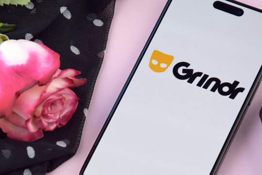 Grindr dating app on smartphone screen.