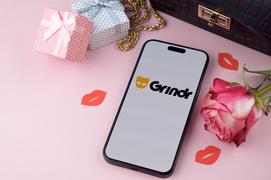 Grindr dating app on smartphone screen.