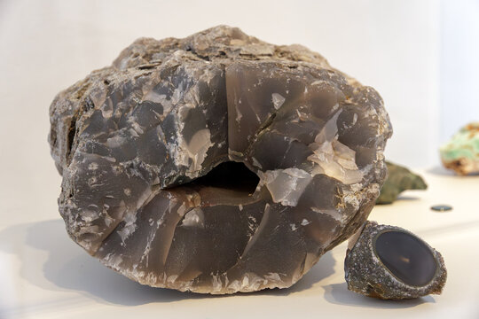 Museum Presentation Highlighting Complex Layers And Crystalline Structures Within Agate Geodes