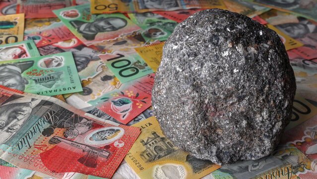 Zinc and lead mine, mining in Australia.  Galena ore isolated on Australian Dollar currency, money, notes. Investment, financial stock market, Australian Securities Exchange