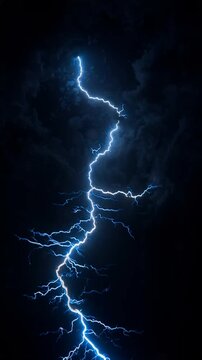 Electric blue lightning bolt strikes dark stormy night sky with clouds