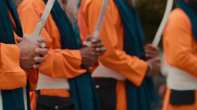 Indian soldiers in orange suit defend Sikh chariot with religious texts Kirpan