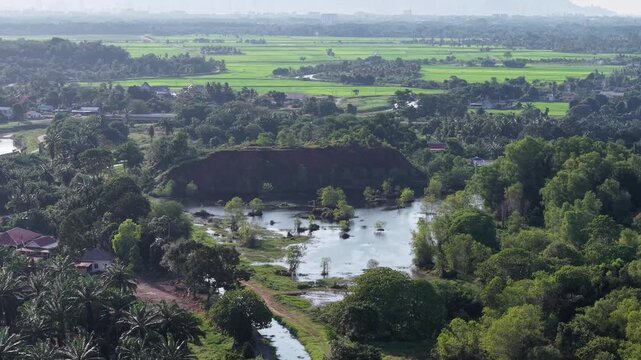 Aerial view of plantation, river, wetlands and rice fields in Kubang Semang.
