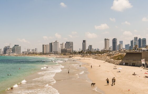 People on the beach, Alma Beach, view of skyline of Tel Aviv with skyscrapers, Tel Aviv, Israel
