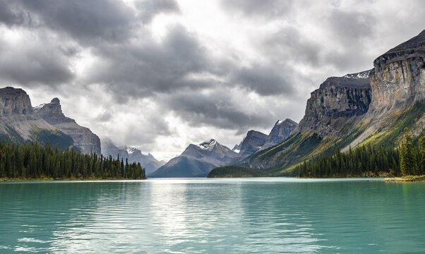 Turquoise blue glacial lake Maligne Lake, mountains Mount Paul, Monkhead and Mount Warren in the back, Maligne Valley, autumn, Jasper National Park National Park, Canadian Rocky Mountains, Alberta, Canada