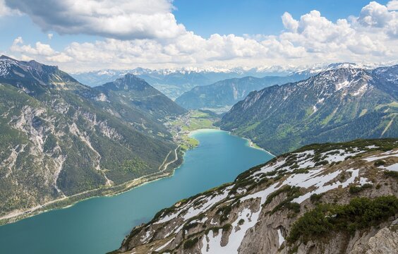 View of Lake Achen and snowy main chain of the Alps, spring, Tyrol, Austria