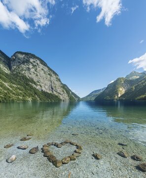 Heart of stones in water, view over Lake K&ouml;nigssee, Berchtesgaden National Park, Berchtesgadener Land district, Upper Bavaria, Bavaria, Germany