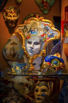 Venetian carnival masks in a shop window, Venice, Veneto, Italy