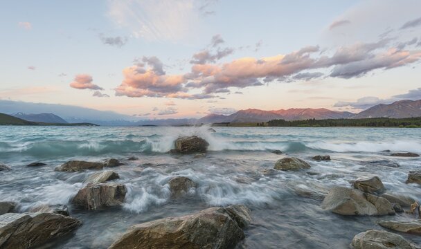 Sunset, waves on the shore of Lake Tekapo, Canterbury Region, Southland, New Zealand