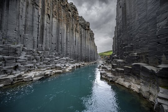 Stu&eth;lagil Canyon, turquoise river between basalt columns, Egilsstadir, Iceland