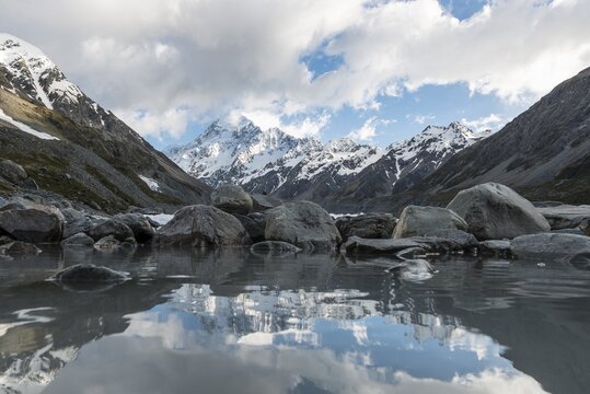 Reflection on the shore of Hooker Lake, at back Mount Cook, Hooker Valley, Mount Cook National Park, Southern Alps, Canterbury Region, Southland, New Zealand