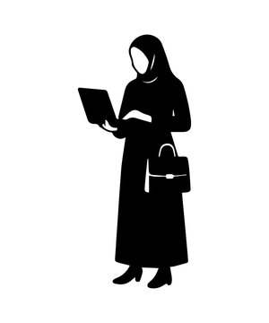 Muslim businesswoman silhouette in hijab working on laptop