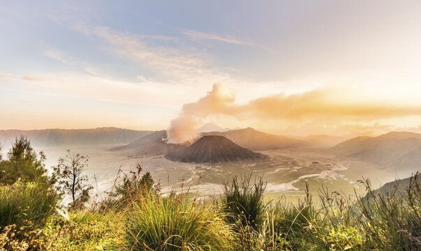 Sunrise, smoking volcano, Gunung Bromo, Mount Batok, Mount Kursi, Mount Semeru, Bromo Tengger Semeru National Park, Java, Indonesia