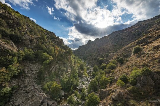 Lower Golo Valley, river Golo, sun shining through clouds, Corsica, France
