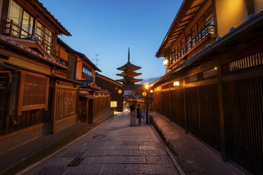 Yasaka dori historic street in the old town with traditional Japanese houses, five-story Yasaka Pagoda of the Buddhist Hōkanji Temple at the back, evening mood, blue hour, Higashiyama, Kyoto, Japan