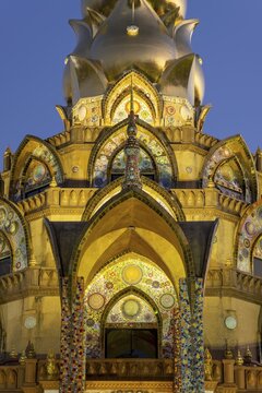Main chedi (Phra That) decorated with over 5 million colourful mosaic stones and ceramic pieces, at sunset, Buddhist temple complex Wat Phra That Sorn Kaew, Phetchabun province, Thailand