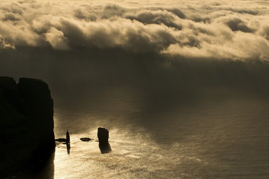 Kollur Mountain and the sea stacks of Risin and Kellingin in the evening light, Ei&eth;i, Eysturoy, Faroe Islands, Denmark