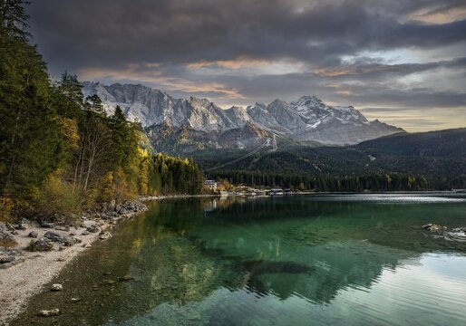 Eibsee lake with Zugspitze massif and Zugspitze, Wetterstein mountains at sunset, near Grainau, Upper Bavaria, Bavaria, Germany