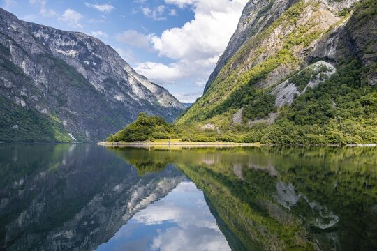 Mountains reflected in the water, Naeroyfjord, Aurland, Sogn og Fjordane, Norway