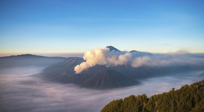 View of volcanoes at sunrise, smoking volcano Gunung Bromo, Batok, Kursi, Gunung Semeru, Bromo-Tengger-Semeru National Park, Java, Indonesia