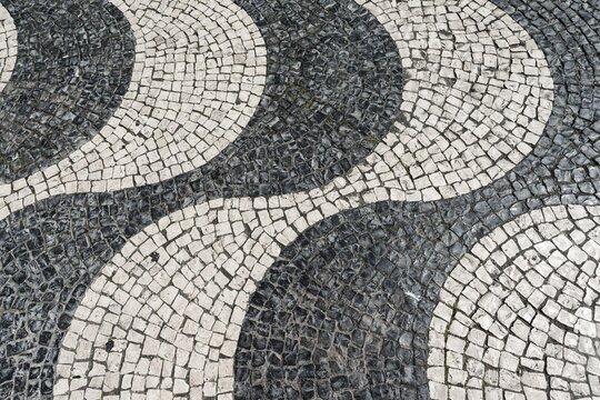 Wavy pattern in pavement, black and white, cobblestones, Rossio, Lisbon, Portugal