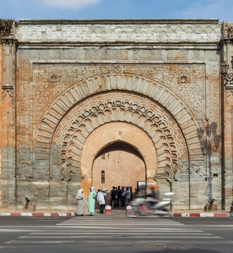 Native women in front of Bab Er Robb, old gate of the city wall, Marrakech, Morocco