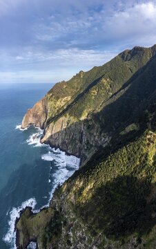View of cliffs and mountains overgrown with forest, coast and sea, coastal landscape, Vereda do Larano hiking trail, Madeira, Portugal