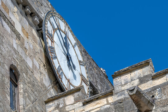 peregrine falcon perched near the clock  on Romsey Abbey Hampshire England