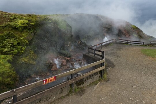 Warning sign on a fence, hot spring Deildartunguhver, highest-flow hot spring of Iceland with 180 liters of boiling water per second, Reykholtsdalur, Iceland