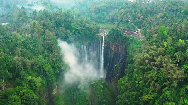 Drone flight footage of stunning Tumpak Sewu waterfall, East Java, Indonesia