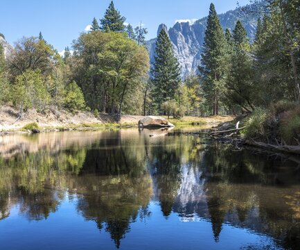 Mountains reflected in water, Merced River, Yosemite Valley, Yosemite National Park, UNESCO World Heritage Site, California, USA