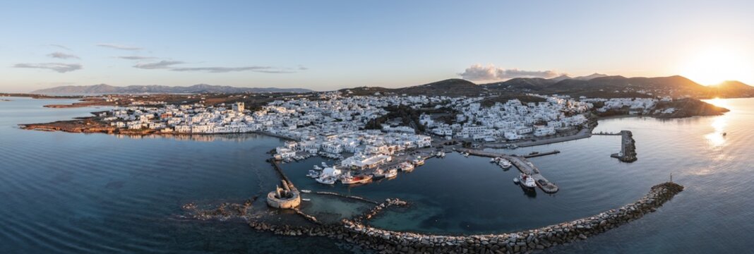 Sunset, aerial view, town view and harbour of Naoussa, harbour wall with Venetian ruins, Paros, Cyclades, Greece