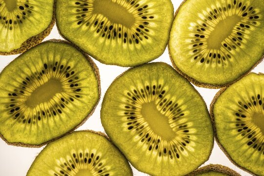 Sliced kiwi, fruit, white background, food photography