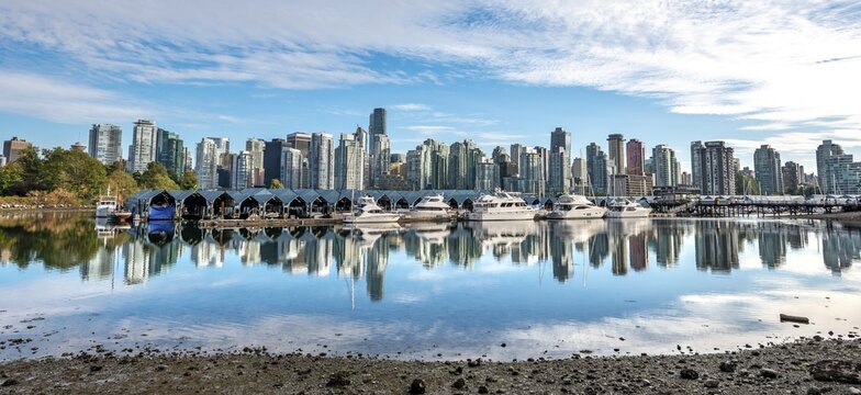 Skyscrapers and sailboats in the marina, skyline of Vancouver reflected in the sea, Coal Harbour, Downton Vancouver, British Columbia, Canada