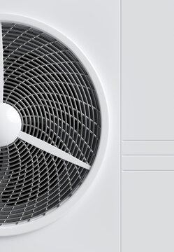Close-up of a modern white air conditioner unit with a metallic fan grill