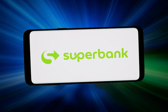Stuttgart, Germany - 04-09-2026: In this photo illustration, the logo of company Bank Fama International (Superbank) is displayed on a smartphone in front of abstract background on computer screen.