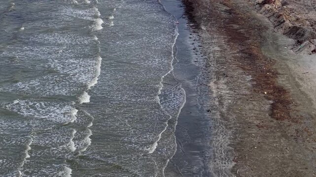 Ocean waves create zigzag patterns on the water surface
