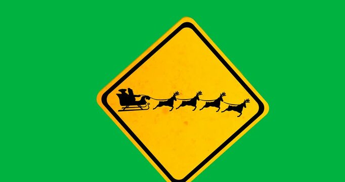 Santa claus in sleigh being pulled by reindeers on yellow sign post against black background