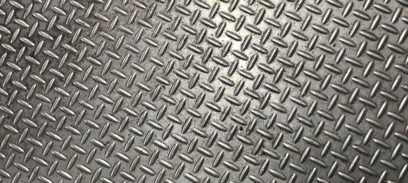 The diamond plate  also known as tread plate or checkered steel plate. which is a type of metal stock with a regular pattern of raised diamonds or lines on one side.