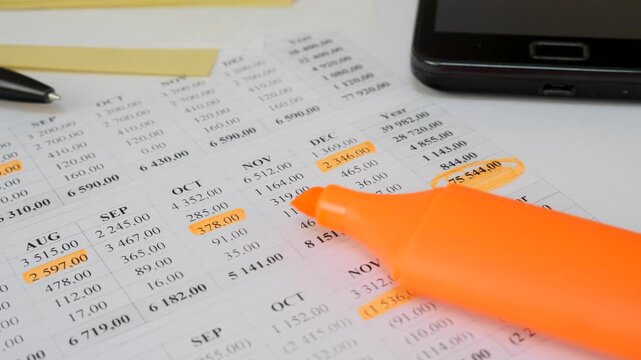 Organizing personal budget with financial tracking. Monthly expense and income sheet with important figures highlighted. Helps improve financial discipline and spending awareness