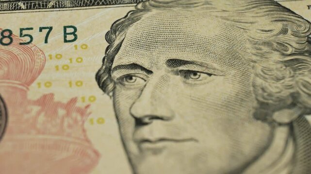 Detailed depiction of notable person Alexander Hamilton on monetary note. Shadows highlight facial contours. USA money banknote. Personal savings and cash reserves for emergencies