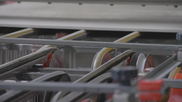 Manufacturing facility produces ceramic tiles using conveyor belt systems to streamline the process. The process of making tiles is carried out in a factory dedicated to tile production