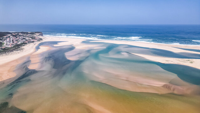 Foz do Arelho, Portugal - Panoramic beach scene with natural sand formations and calm ocean waters