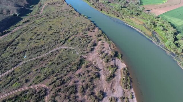 Aerial view of still waters of the Yenisei Angara and Selenga rivers across Siberia. Coastal wetland, mongolia river, central asia, watercourse depict freshwater geography habitat value.
