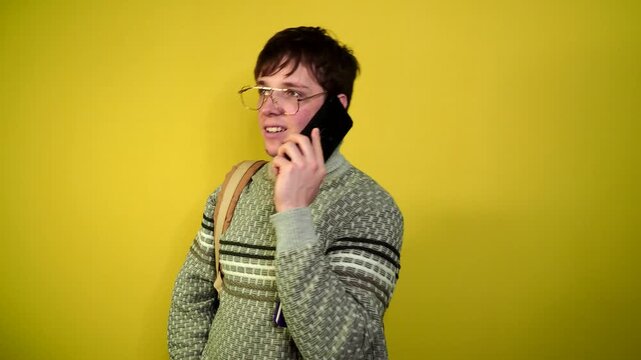 Phone call by cellphone. Attractive charismatic stylish guy has an unpleasant phone