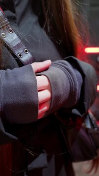 Close-Up of Hands Tucking into Clothing for Warmth from Cold
