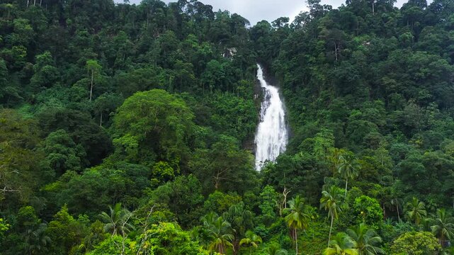 A beautiful waterfall in the mountains among the jungle. Mapalana Falls. Sri Lanka.