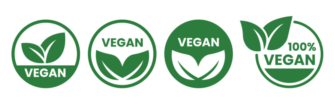 Four circular green vegan symbols and labels are displayed promoting plant based and cruelty free products high quality professional detailed modern